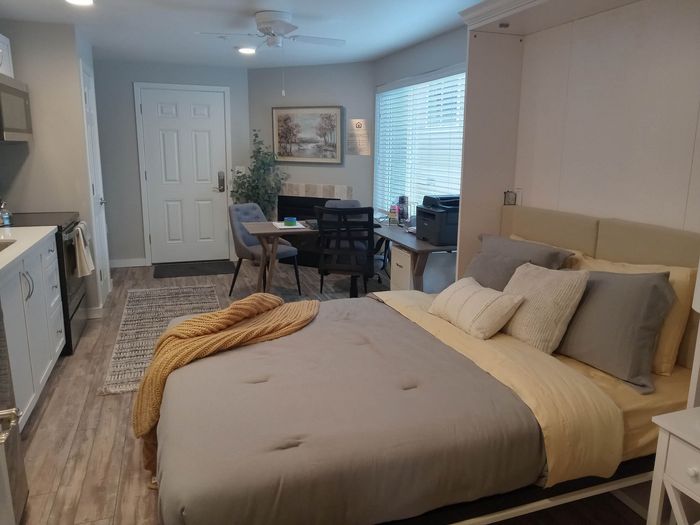 Cozy bedroom area with large window at Lakeside Place in Bend.