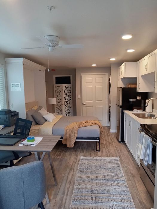 Fully furnished studio apartment interior at Lakeside Place.