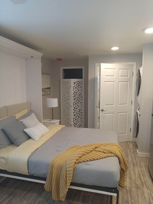 Stylishly decorated bedroom highlighting modern living at Lakeside Place.