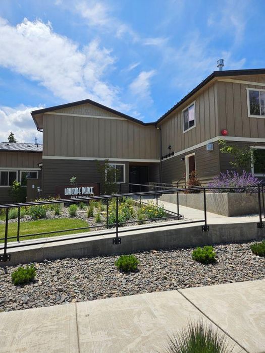 Multi-level residential building with modern trim at Lakeside Place.