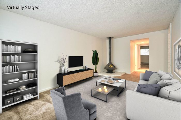Virtually staged living room with contemporary furniture and a fireplace at CAMPBELL PARK.