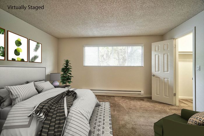 Virtually staged bedroom showcasing layout possibilities with a large bed at CAMPBELL PARK.
