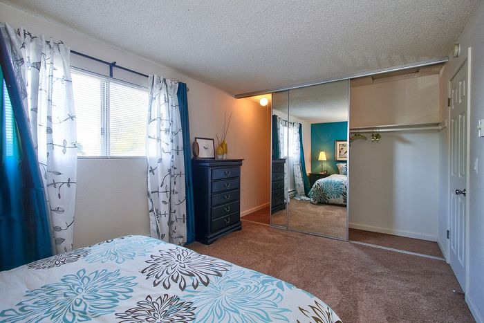 Comfortable bedroom space showing a large walk-in closet entryway at CAMPBELL PARK.