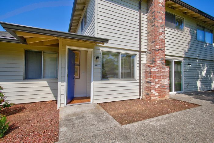 Two-story residential building exterior and entry walkway at CAMPBELL PARK.