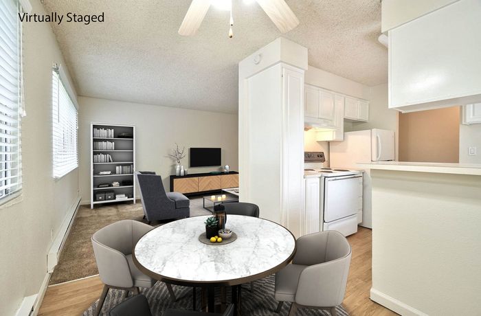 Virtually staged dining area and kitchen setup showing modern design at CAMPBELL PARK.