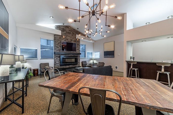 Polished wooden conference table inside the resident clubhouse at Berkeley Heights Apartment Homes.