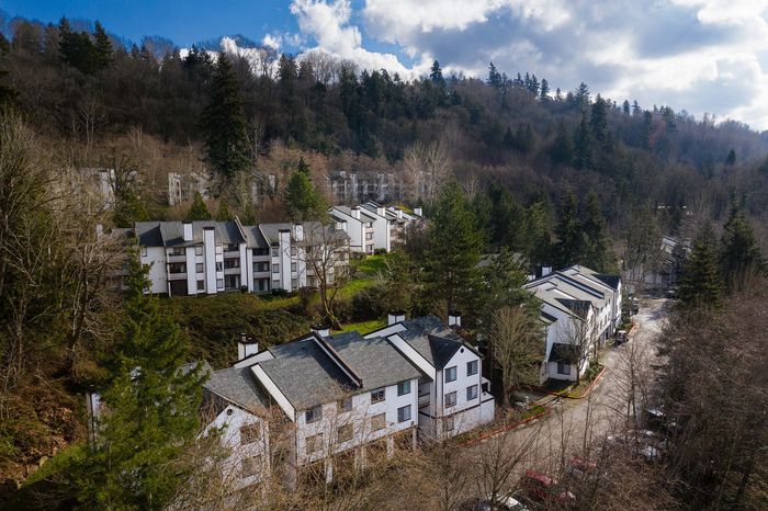 Aerial drone view of multi-level buildings on a hillside at Berkeley Heights Apartment Homes.