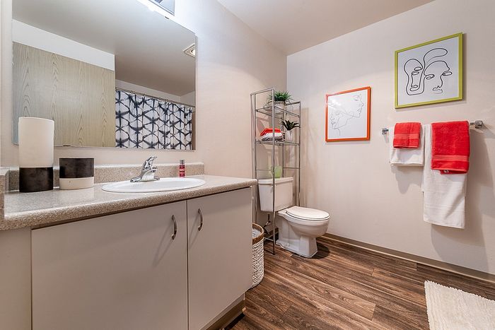 Clean bathroom space displaying a vanity sink and towel rack at Berkeley Heights Apartment Homes.