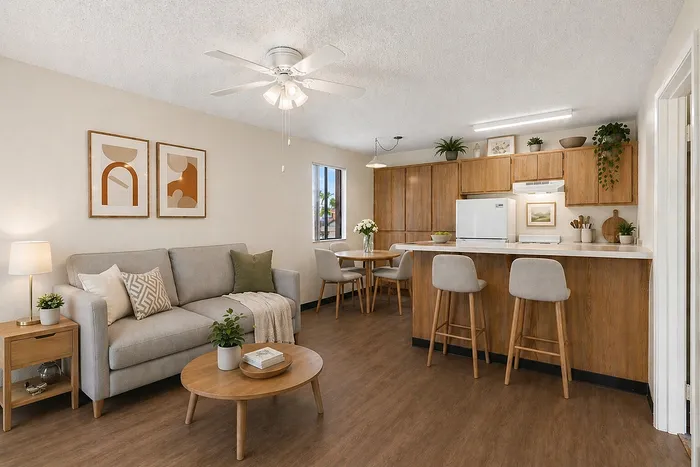 Virtually Staged living room at Orchard mesa with a couch, barstools and dining table