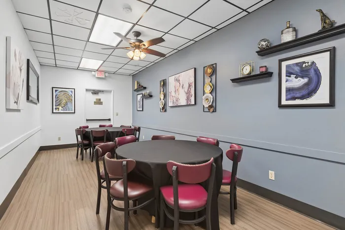 Community dining room at Orchard Mesa with tables and chairs