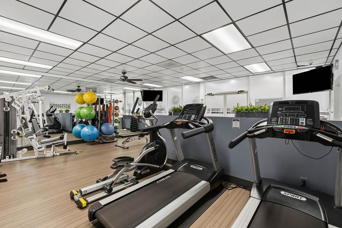 Fitness room at Orchard Mesa with various fitness equipment