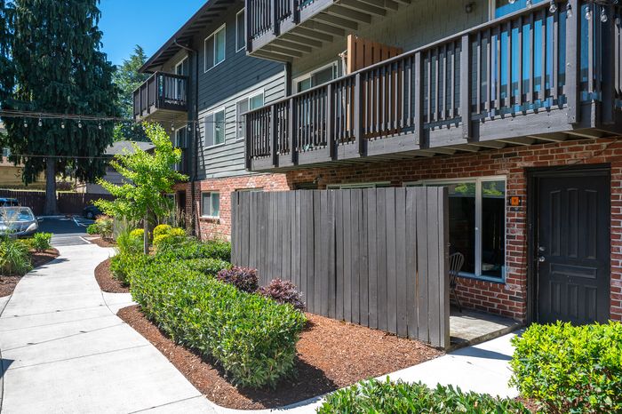 Creston Villa exterior with landscaping and fenced in areas