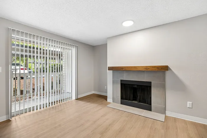 Living Room at Timber Flats unit E101 with a fireplace