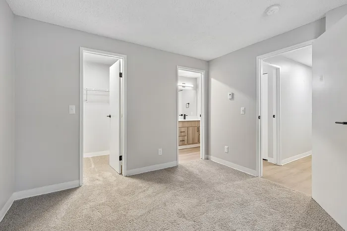 Primary bedroom at Timber Flats with attached bathroom and walk-in closet