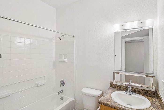 bathroom at ventura villas with a toilet, shower/tub combo and sink