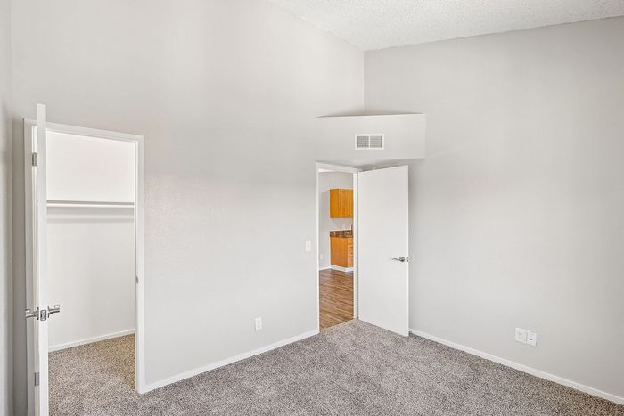 bedroom at ventura villas with carpet and walk-in closet