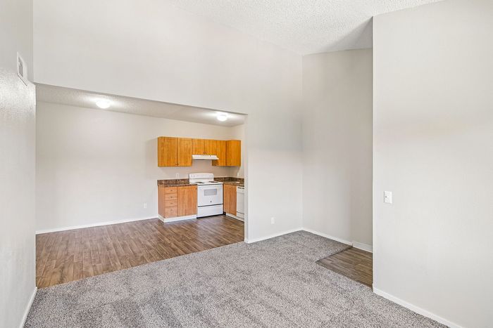 view into the kitchen at ventura villas 1x1 with carpet and hardwood floors