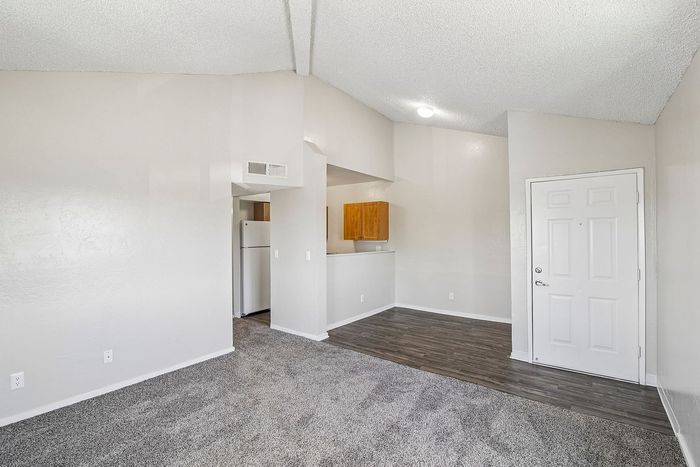 living room and entry at ventura villas with dining room and carpet