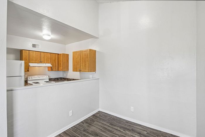 dining room in 2x1 floorplan with view into the kitchen