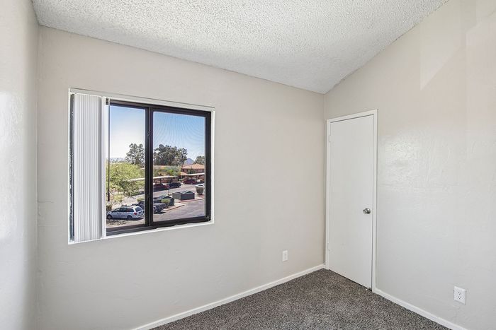 secondary bedroom at ventura villas with a window and carpet