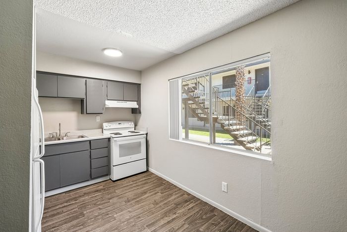 Deer Valley Village kitchen and dining space with large window overlooking exterior stairs.