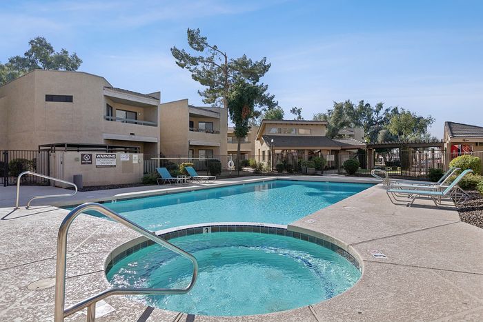 Pool and hot tub at Silver Creek with lounge chairs