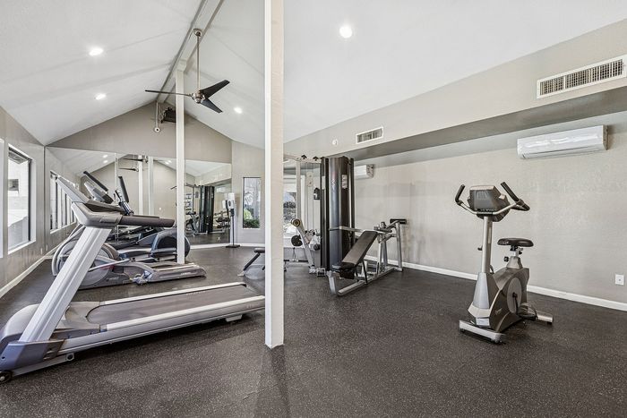 Gym at Silver Creek with treadmill, stationary bike and other equipment