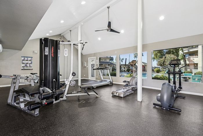Gym at Silver Creek with treadmill, stationary bike and other equipment