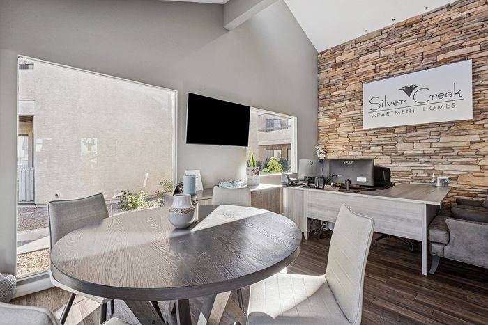 Leasing office at Silver Creek with a desk and seating