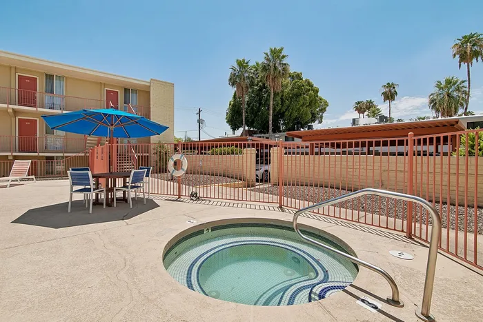 Hot tub at solaris at the biltmore with table and umbrella close to it