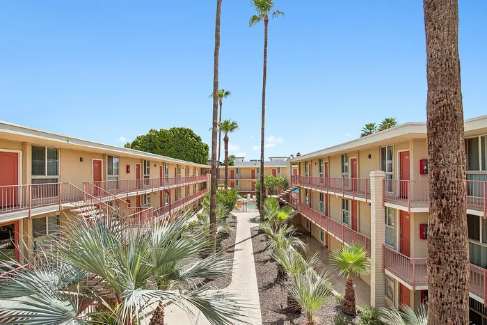 Courtyard at Solaris at the biltmore with palm trees and garden style entry