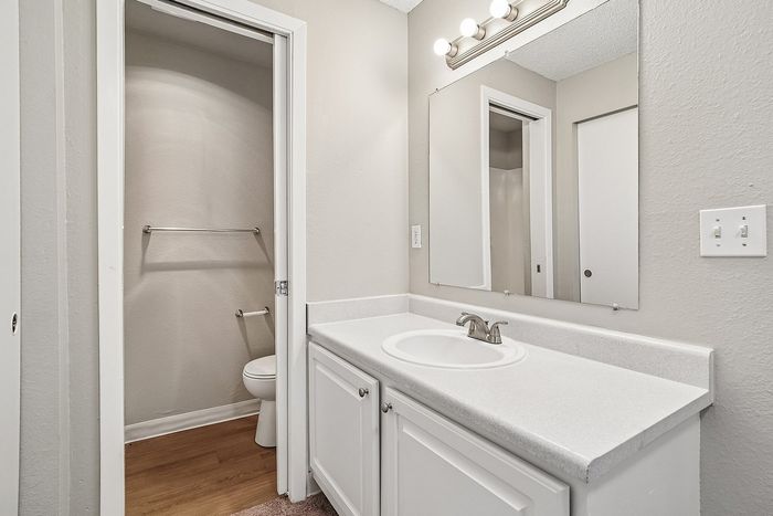 Bathroom at Creekwood with seperate room for toilet and shower