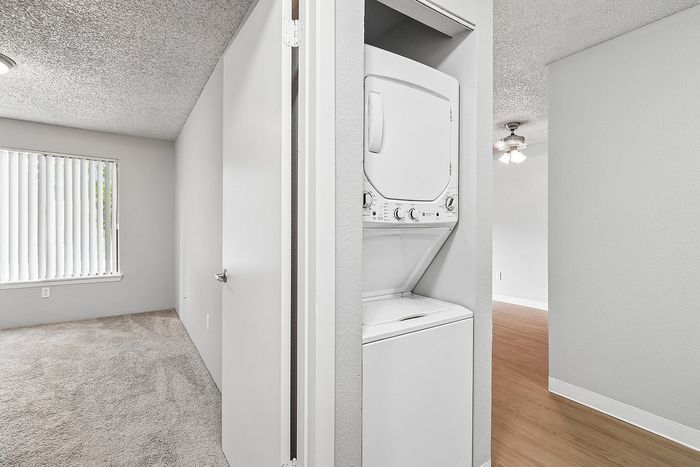 Stacking washer and dryer in a unit at Creekwood