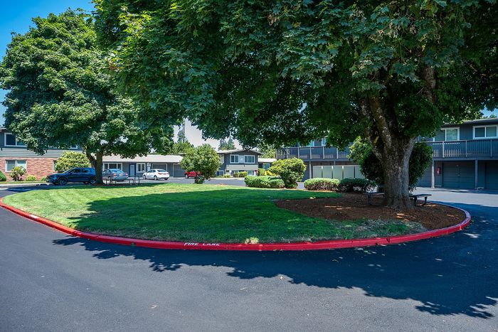 exterior of hidden court apartments with big trees