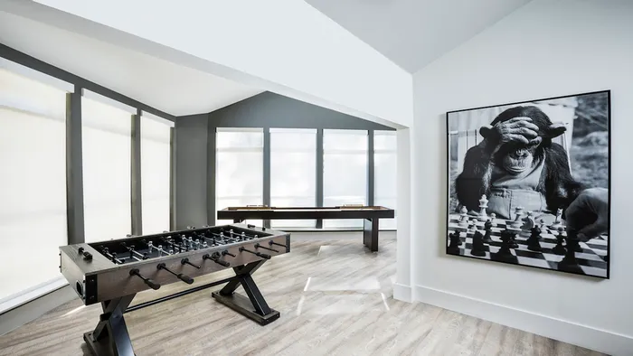 Resident Lounge with Foosball and Shuffleboard at Autumn Columbia apartments.