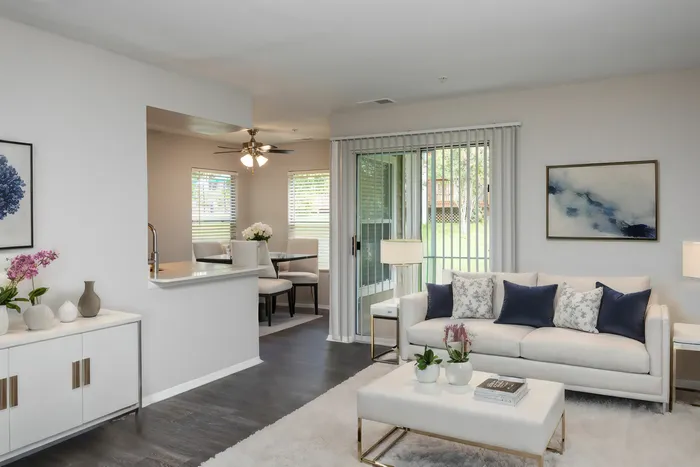 Large open floor plan with wood flooring throughout Countertops and White Cabinetry at Autumn Town Center Columbia apartments.
