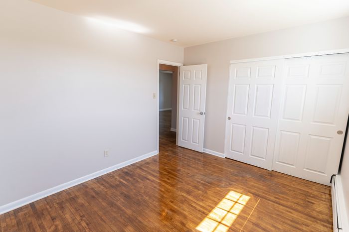 bedroom with wood floor