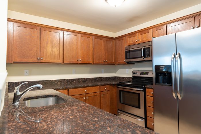 kitchen with modern appliances and lots of cabinets