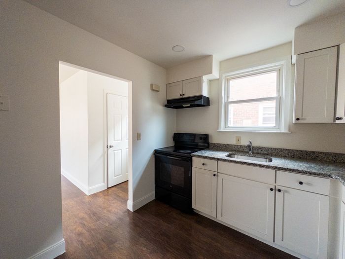 kitchen leading to living room and under-stair storage