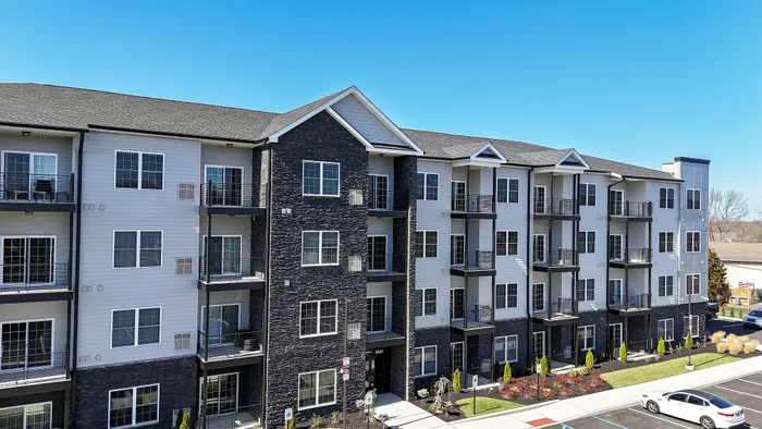 the warrington place apartments in warrington pa, 4 story luxury apartment building with lush landscaping