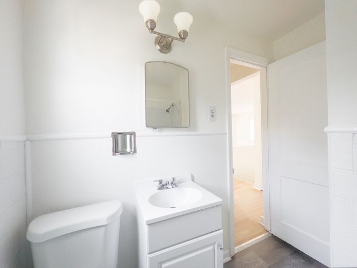 Bright and inviting bathroom with modern fixtures, elegant vanity, and ample natural light for a refreshing atmosphere.