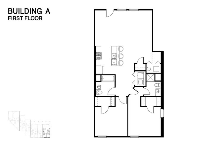 Modern first floor plan of Building A featuring an open-concept design with a spacious kitchen and inviting living area.