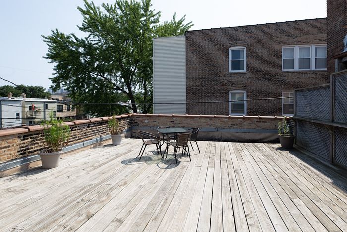 A shared wooden deck for summertime use.