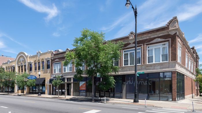 Exterior of 5531-39 North Clark Street a handsome two story vintage brick building with storefronts on the first floor in Andersonville.