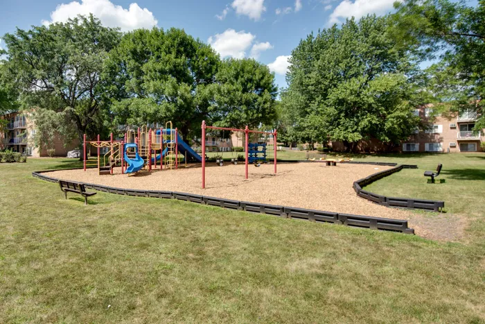 A children's playground with a jungle gym located on-site.