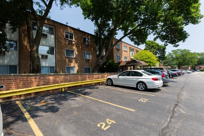An ample surface parking lot adjacent to the building.