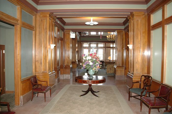 Restored historic lobby with walnut paneling.