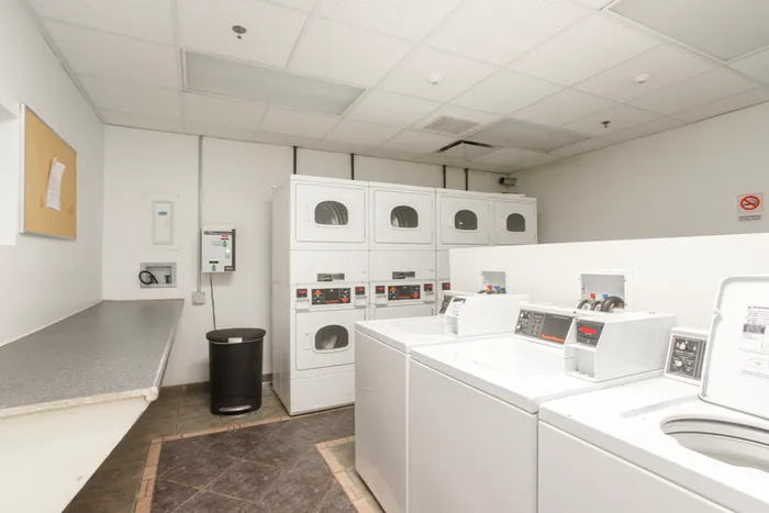 Onsite laundry room with multiple washers and dryers