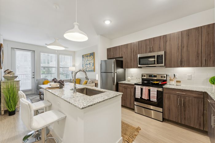 Enjoy cooking and entertaining around our spacious, modern kitchen islands at Latitude Apartments