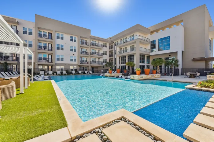 A beautiful high-end swimming pool and cozy lounge areas at Latitude Apartments